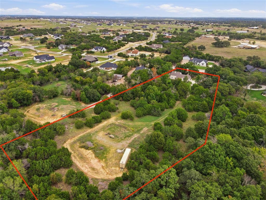 308 Constitution Court, Weatherford, TX 76088 Expansive acreage featuring mature trees, natural terrain, and established vegetation