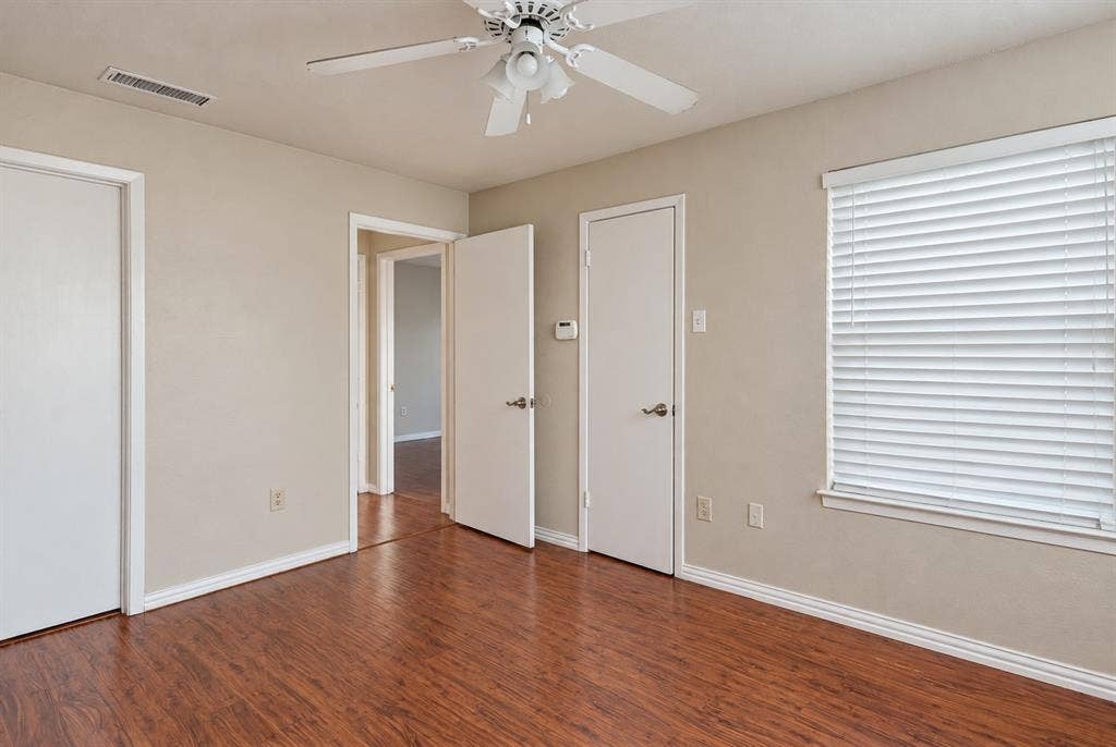 895 Dublin Drive, #4, Richardson, TX 75080 Room featuring wood-finish flooring, a ceiling fan with integrated lighting, and window blinds