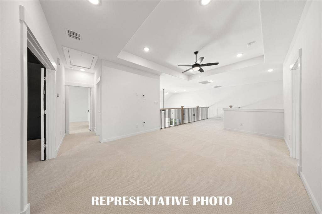 Light and bright, the family will love getting together for game night in this wonderful game room!  REPRESENTATIVE PHOTO