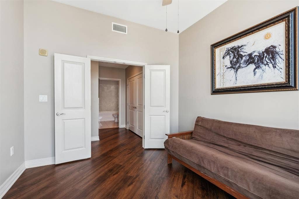 500 Throckmorton Street, #2702, Fort Worth, TX 76102 Vaulted ceilings, wood-finish flooring, two-panel interior doors, and neutral wall tones