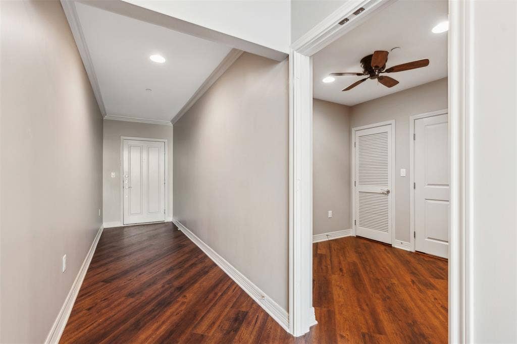 500 Throckmorton Street, #2702, Fort Worth, TX 76102 Entryway and office featuring wood-finish flooring, neutral wall paint, recessed lighting, crown molding, and a paneled entry door