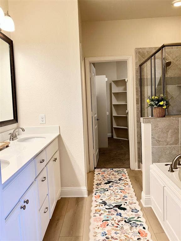 En-suite main bath, double sinks, separate tub, shower, toilet. Walk-in closet.
