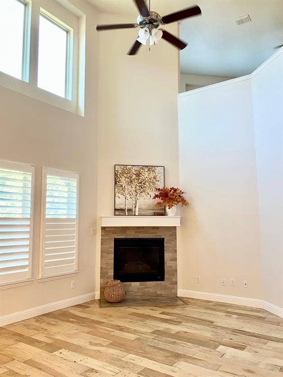 Soaring ceiling, tasteful new paint, sanded wood flooring, rich custom shutters