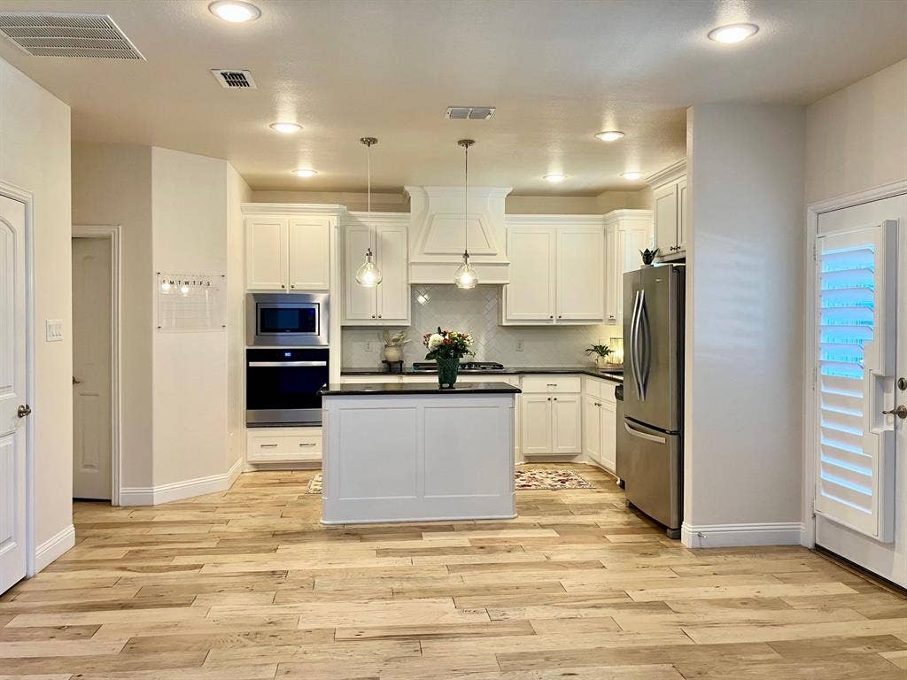 Pantry, Laundry room, garage to left, patio to right.