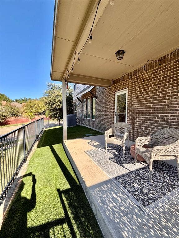 Wrap around covered patio w yard below