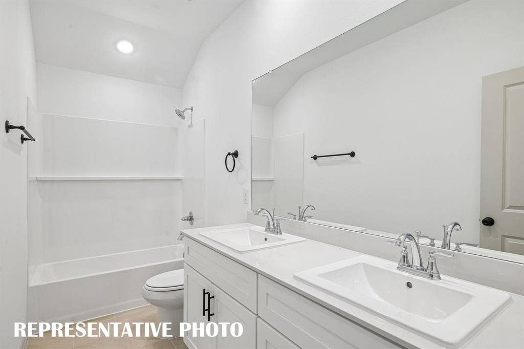 Guests will enjoy their own vanity space in this lovely guest bath built for two!  REPRESENTATIVE PHOTO