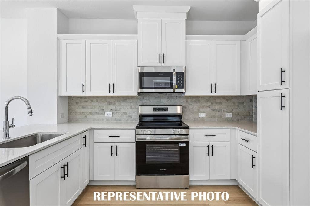 With ample storage and prep space, your inner chef will come alive in this beautiful kitchen!  REPRESENTATIVE PHOTO