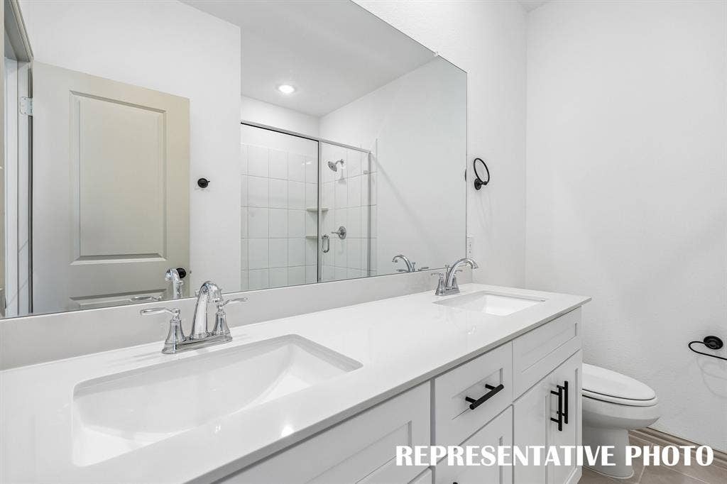 Your new owner's bath features a lovely walk in shower with double vanity.  REPRESENTATIVE PHOTO