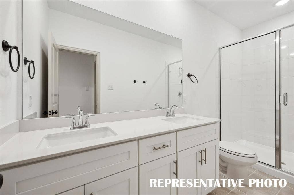 5312 Springlake Parkway, Haltom City, TX 76117 Ample room for two in this lovely owner's bath featuring dual vanity sinks and spacious walk in shower. REPRESENTATIVE PHOTO