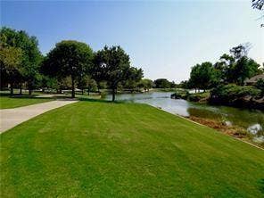 14800 Enterprise Drive, #22D, Farmers Branch, TX 75234 Expansive lawn with mature trees, paved walkway, and direct water frontage