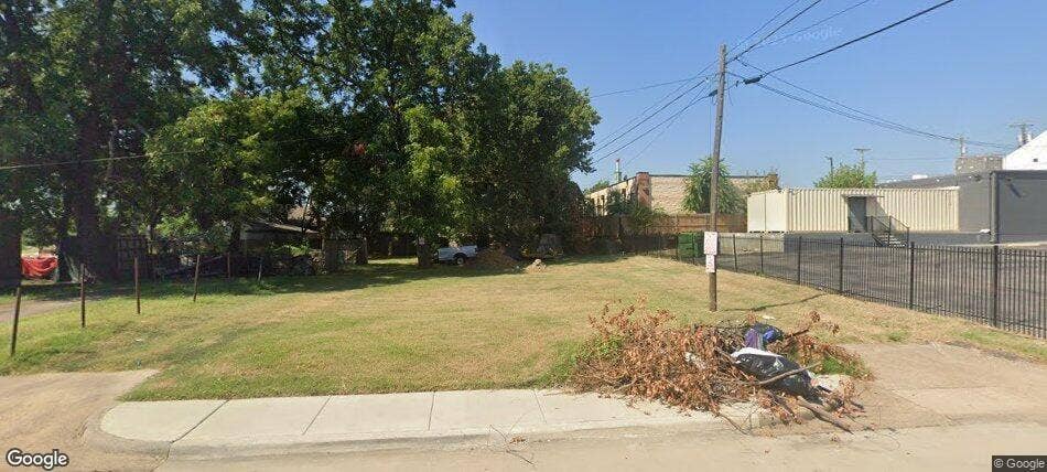 Corner lot featuring established mature trees and concrete curb infrastructure