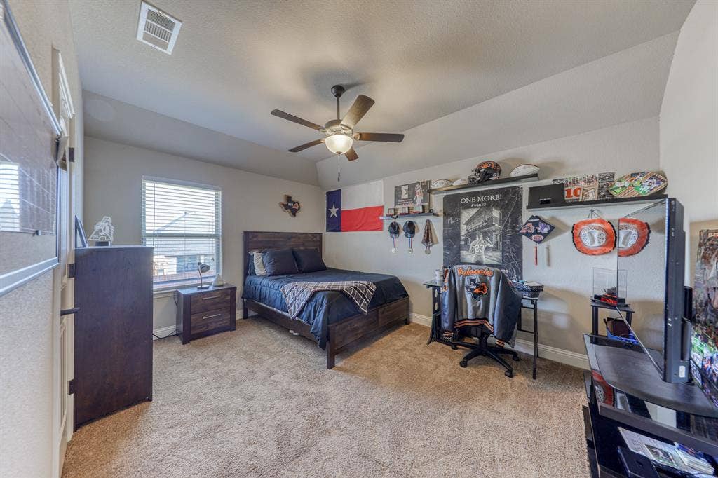 128 Breeders Drive, Willow Park, TX 76087 Vaulted ceiling featuring a central multi-blade ceiling fan and neutral wall-to-wall carpeting
