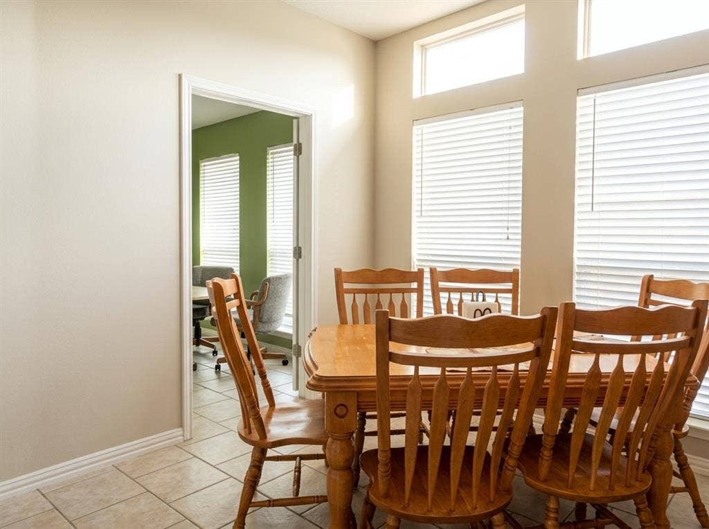 2306 Summit Drive, McKinney, TX 75071 Tiled flooring, high ceilings with transom windows, and neutral wall tones
