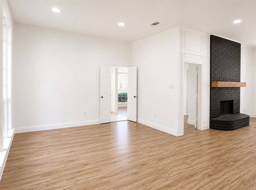2400 Waterloo Lane, Mesquite, TX 75181 Interior space featuring wood-finish flooring, recessed lighting, and floor-to-ceiling wainscoting