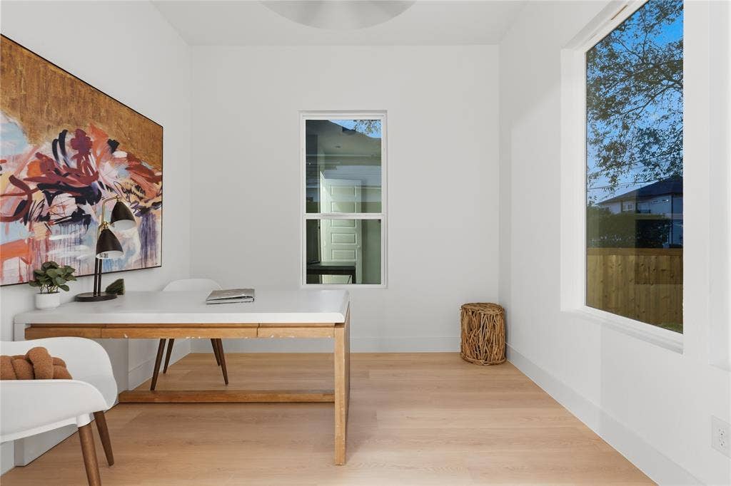 1834 Gallagher Street, Dallas, TX 75212 Bright room featuring wood-finish flooring, crisp white walls, and oversized windows providing natural illumination