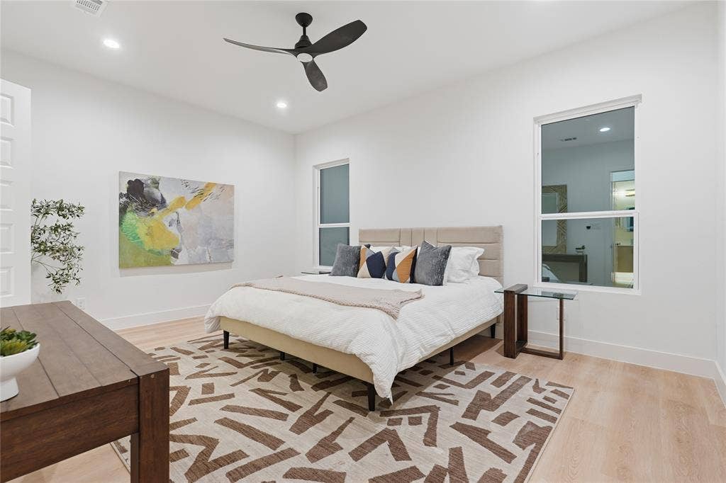 1834 Gallagher Street, Dallas, TX 75212 Spacious interior featuring wood-finish flooring, recessed lighting, and a modern ceiling fan with a matte black finish