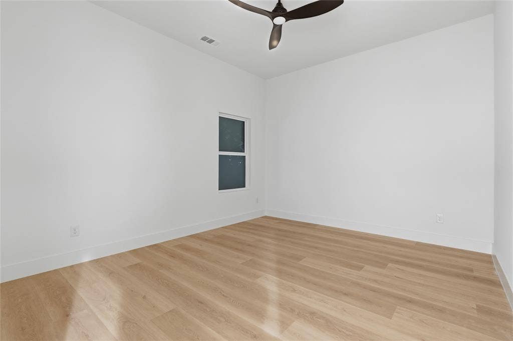 1834 Gallagher Street, Dallas, TX 75212 Room featuring wood-finish flooring, neutral walls, and a multi-blade ceiling fan