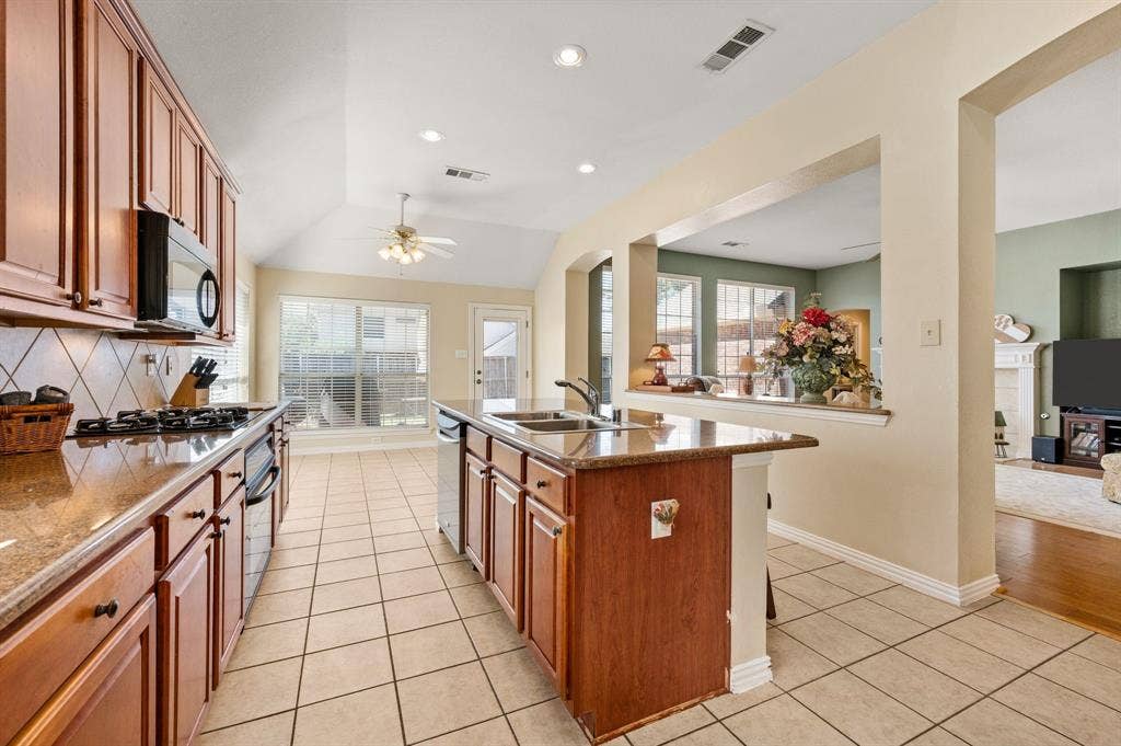 Plenty of cabinets and granite topped counter space