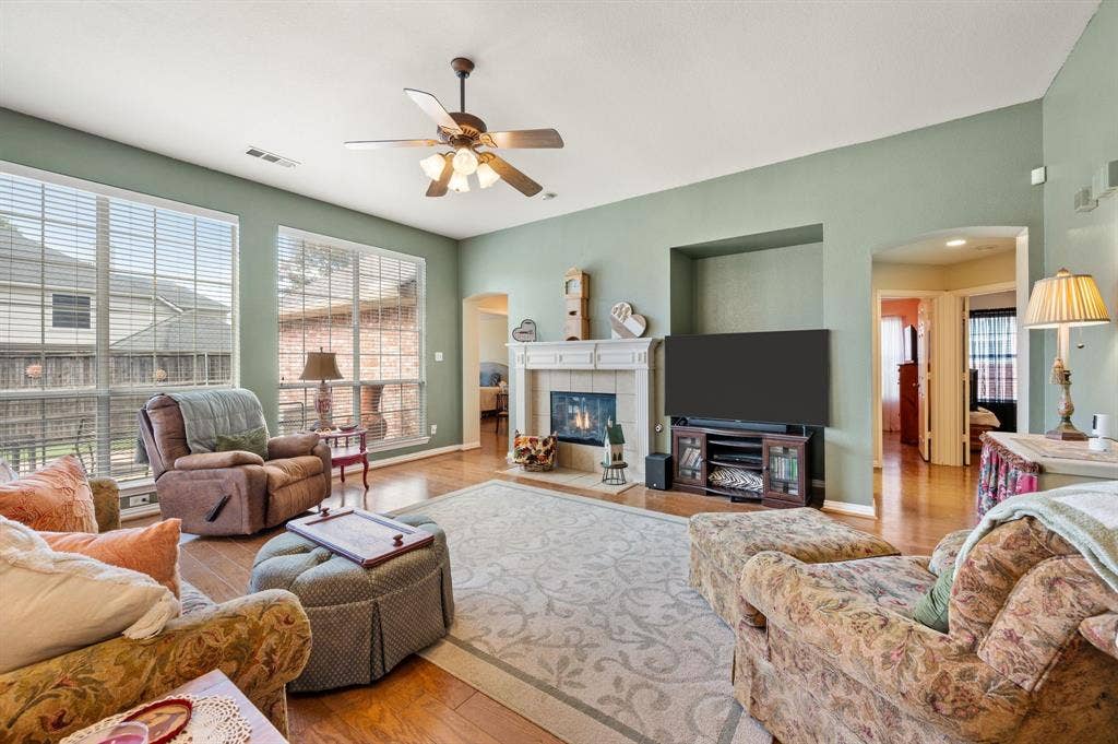 Large family room has fireplace with gas logs