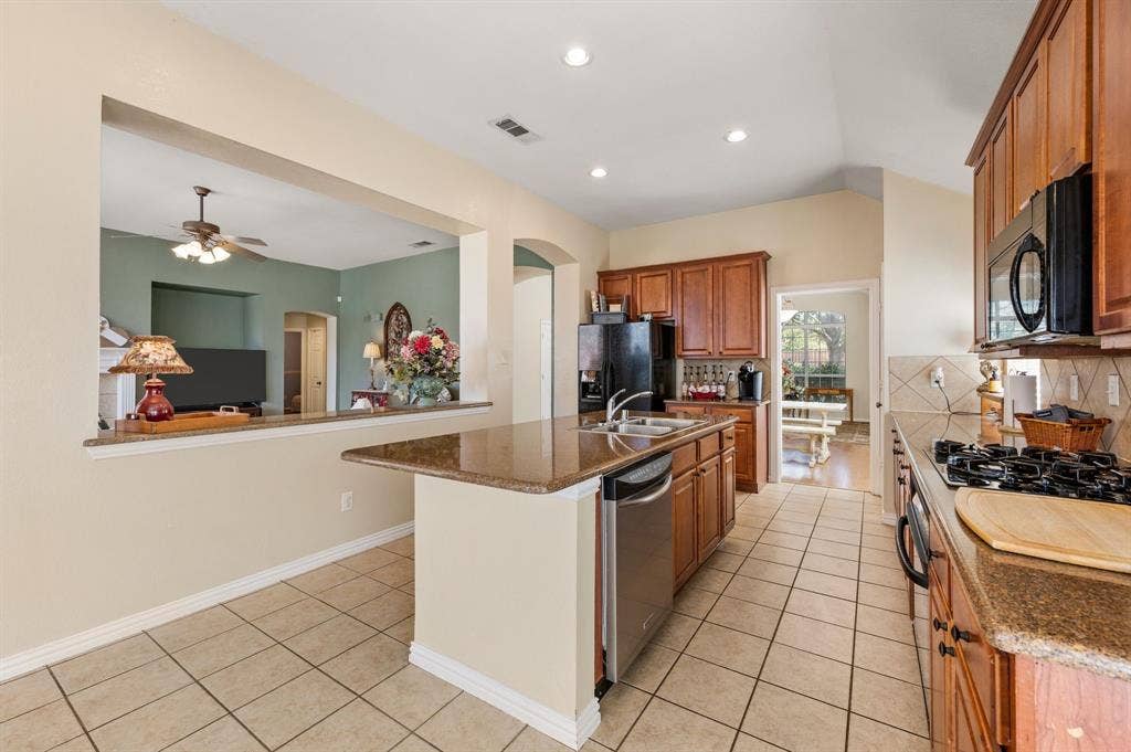 Island kitchen opens to the family room, formal dining and breakfast area