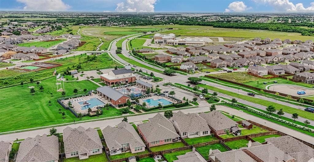 1612 Village Creek Drive, Forney, TX 75126 Aerial view of residential area with a pool
