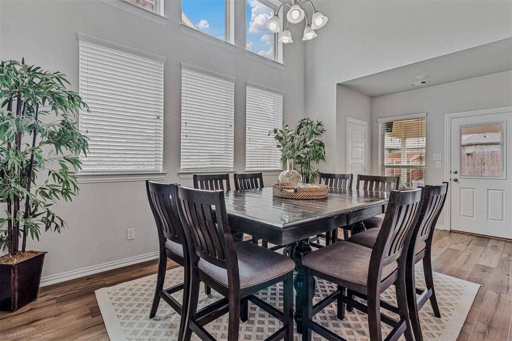 1612 Village Creek Drive, Forney, TX 75126 Dining room with light wood finished floors and a high ceiling
