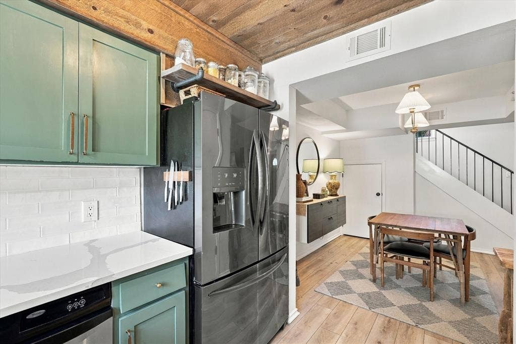 1955 Shorewood Drive, Grapevine, TX 76051 Kitchen featuring painted shaker-style cabinetry, white quartz countertops, subway tile backsplash, and a tongue-and-groove wood plank ceiling