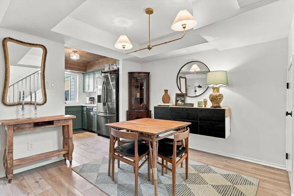 1955 Shorewood Drive, Grapevine, TX 76051 Tray ceiling with integrated lighting, wood-finish flooring, and wall-mounted cabinetry