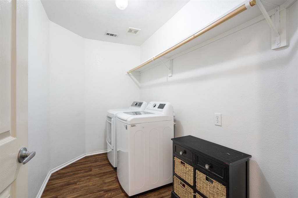 2750 Chalmers Court, Rockwall, TX 75032 The freshly painted laundry room includes the washer and dryer