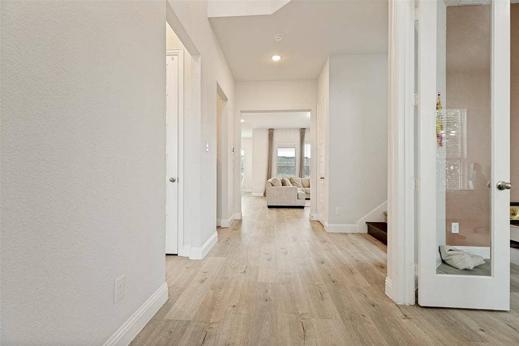 16931 Maple Bend Drive, Frisco, TX 75035 Foyer featuring wood-finish flooring, recessed lighting, and a glass-panel French door