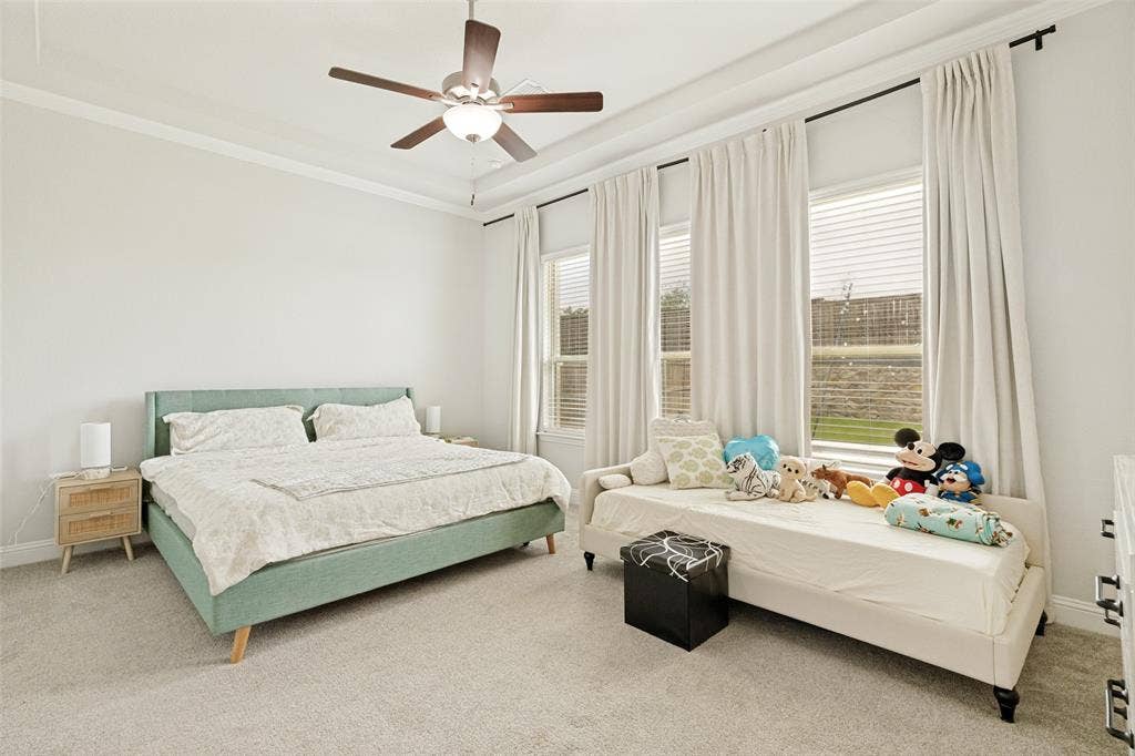 16931 Maple Bend Drive, Frisco, TX 75035 Tray ceiling, central ceiling fan, and large windows with integrated blinds