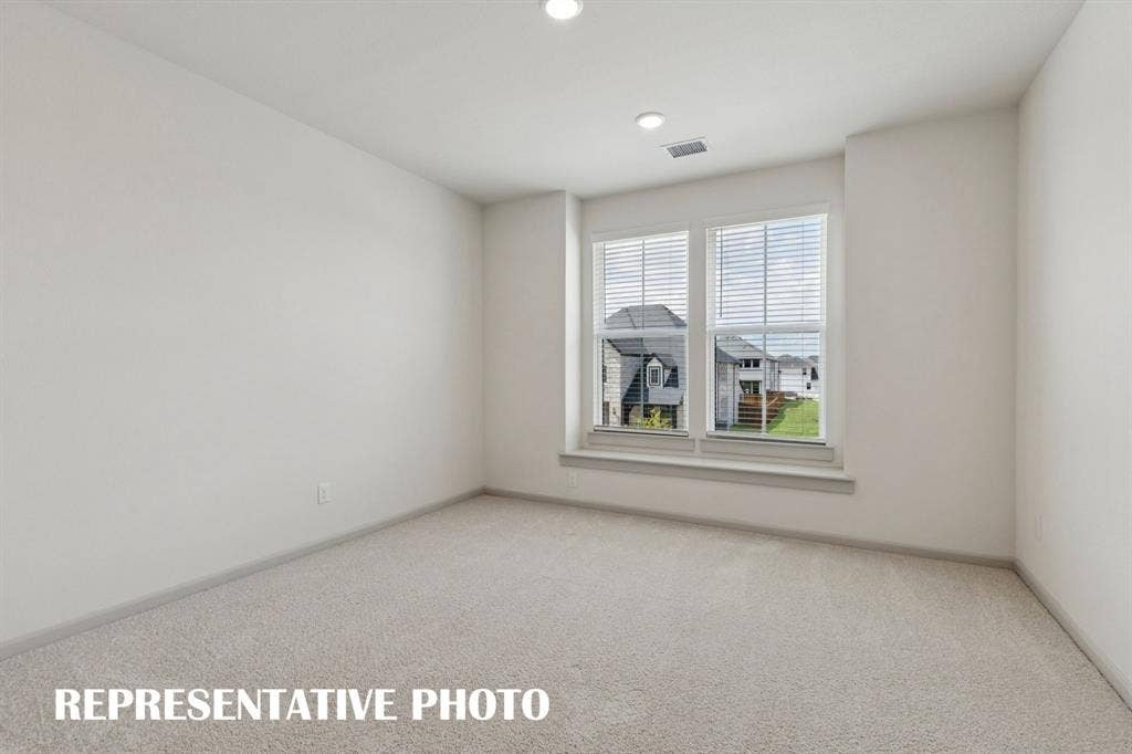 You'll find nicely sized secondary bedrooms in our Rennes plan.  REPRESENTATIVE PHOTO