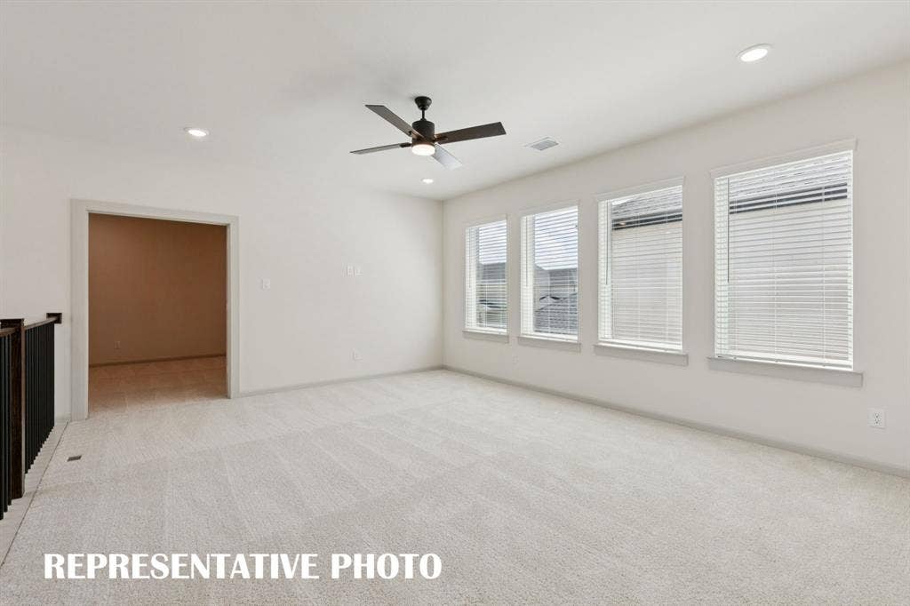 The entire family will enjoy endless fun in this spacious, light filled game room!  REPRESENTATIVE PHOTO