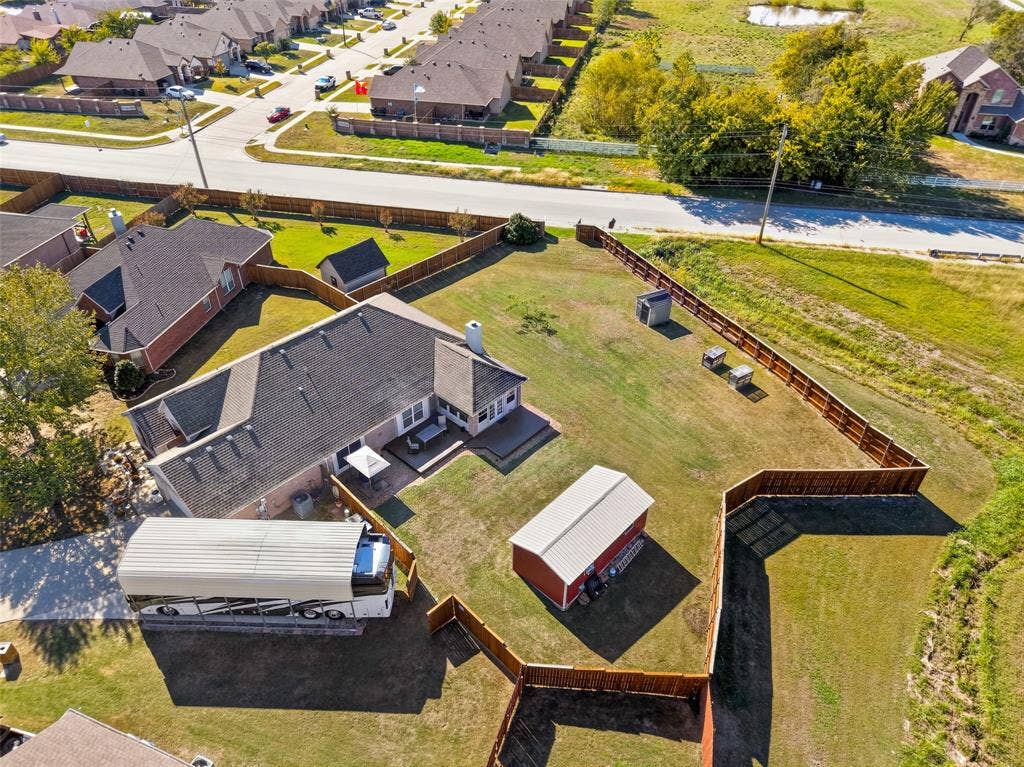 8700 Broken Bow Drive, Greenville, TX 75402 Great aerial showing the size of this RV carport/extra parking!