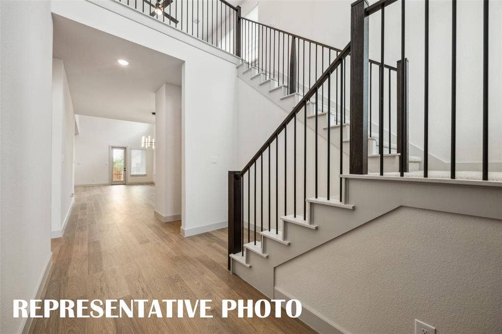Featuring a dramatic switchback staircase and site lines from the front through to the rear of the home, our Gaston plan is truly your dream home come to life!  REPRESENTATIVE PHOTO