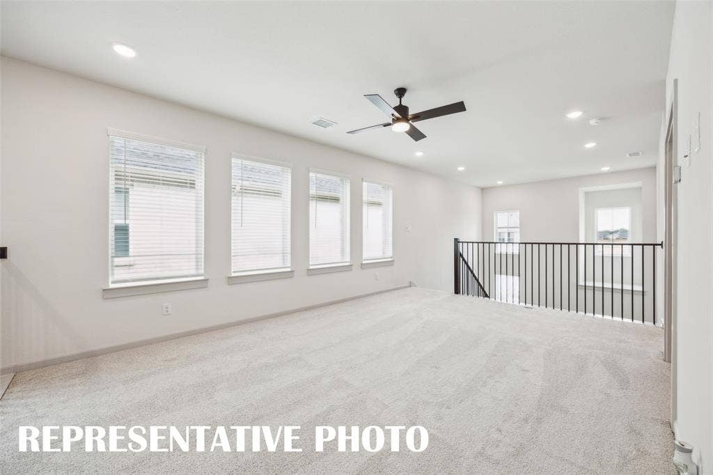 Light, bright and spacious, your new game room, paired with adjacent media room, is the perfect place to host those big game day parties!  REPRESENTATIVE PHOTO