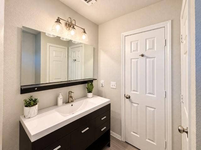 8813 Pheasant Run Drive, Rowlett, TX 75089 Secondary bath vanity linen closet