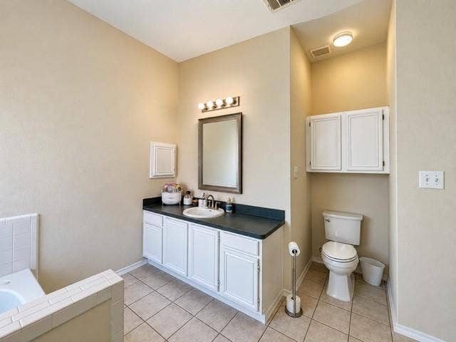 8813 Pheasant Run Drive, Rowlett, TX 75089 Cabinets and plenty of vanity storage natural light
