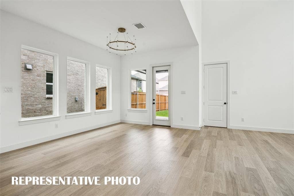 1144 Hyssop Drive, Celina, TX 75009 With a spacious dining room and easy access to the lovely covered back patio, it's easy to dine inside or out in this beautiful home REPRESENTATIVE PHOTO