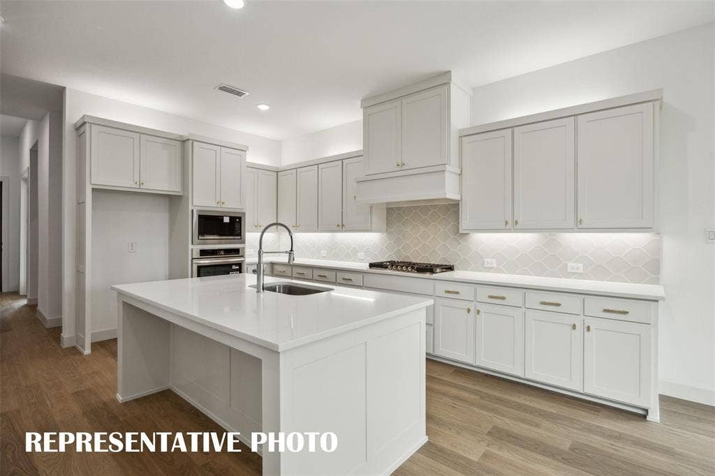 1144 Hyssop Drive, Celina, TX 75009 With fantastic space, ample storage and contemporary appliances, this kitchen is all that you've dreamed of and more! REPRESENTATIVE PHOTO