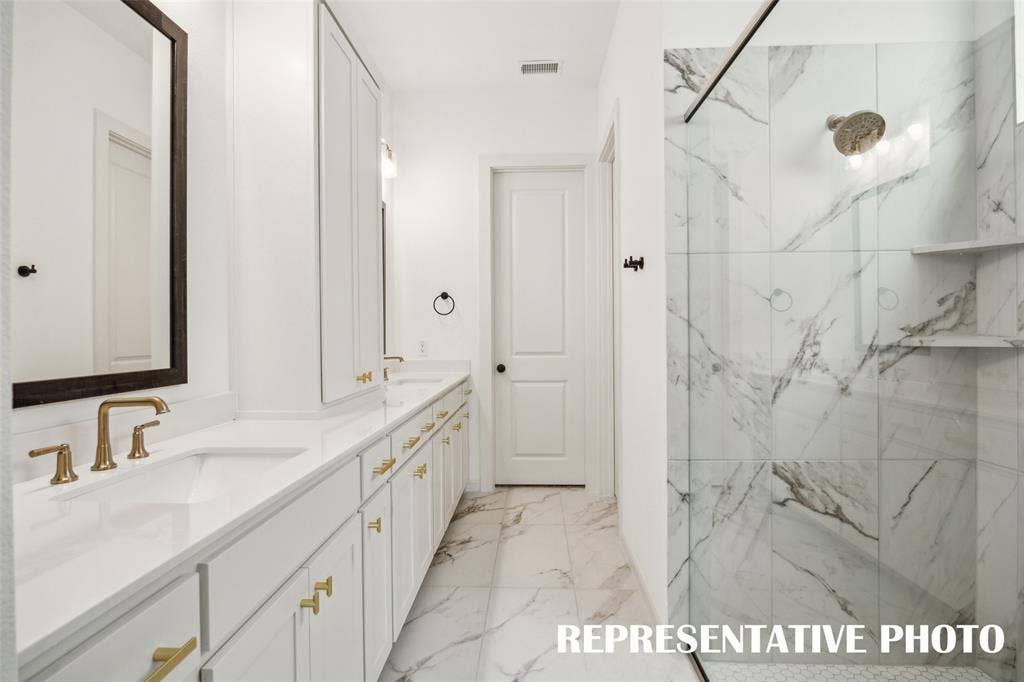 1144 Hyssop Drive, Celina, TX 75009 The spacious owner's bath walk in shower with drying area is the perfect place to start or end you day. REPRESENTATIVE PHOTO