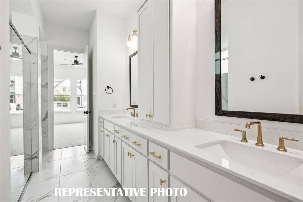 1144 Hyssop Drive, Celina, TX 75009 You'll enjoy ample space for two in this lovely owner's bath! REPRESENTATIVE PHOTO