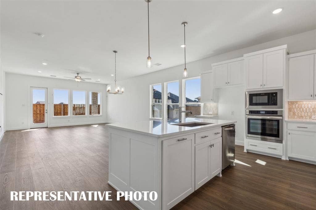 The chef will never be left out of the party in this wonderful open concept dream home!  REPRESENTATIVE PHOTO