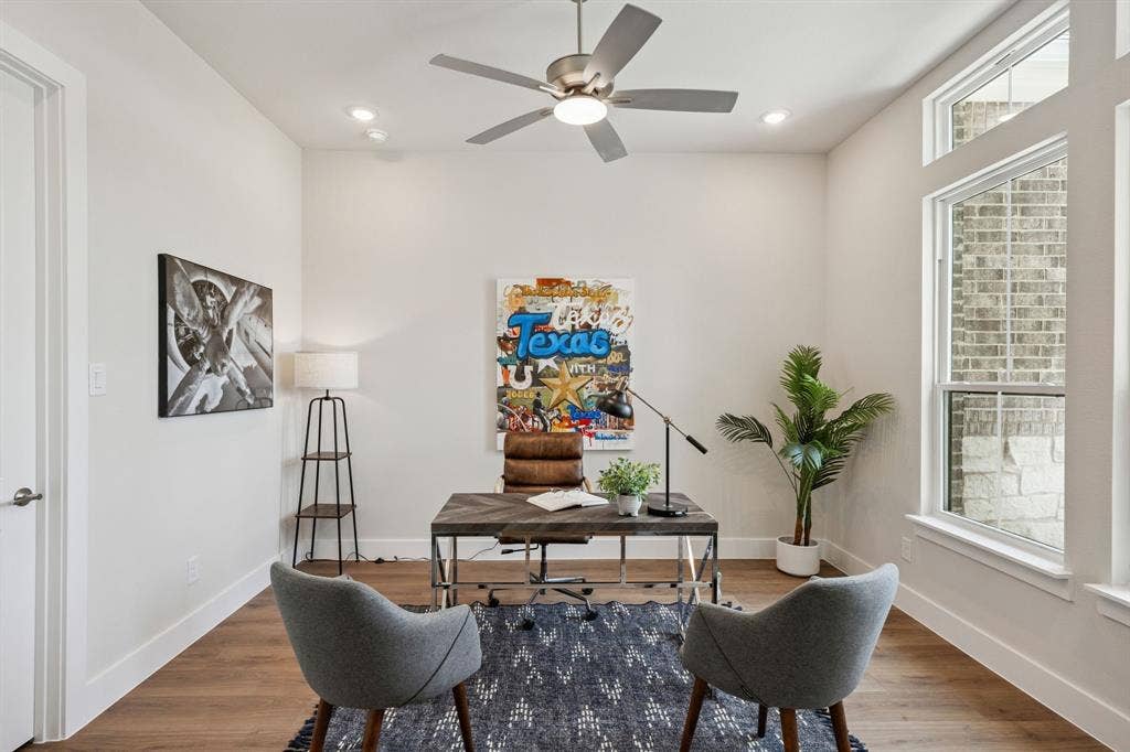 151 Quiet Waters Way, Waxahachie, TX 75165 Room featuring wood-finish flooring, recessed lighting, a brushed-metal ceiling fan, and tall windows with natural light