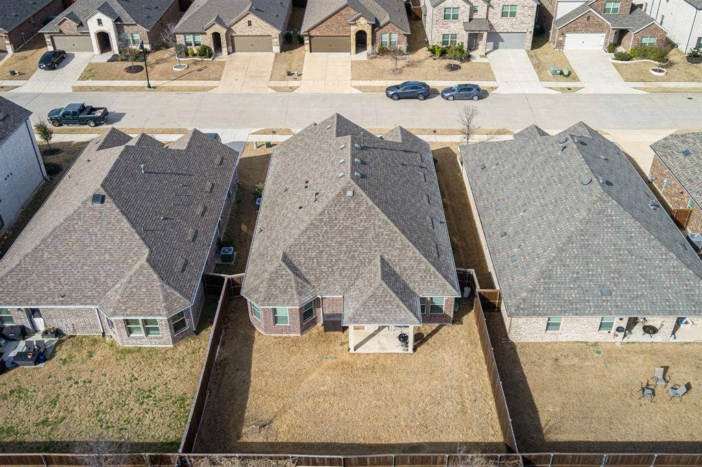 View of the back of home and backyard