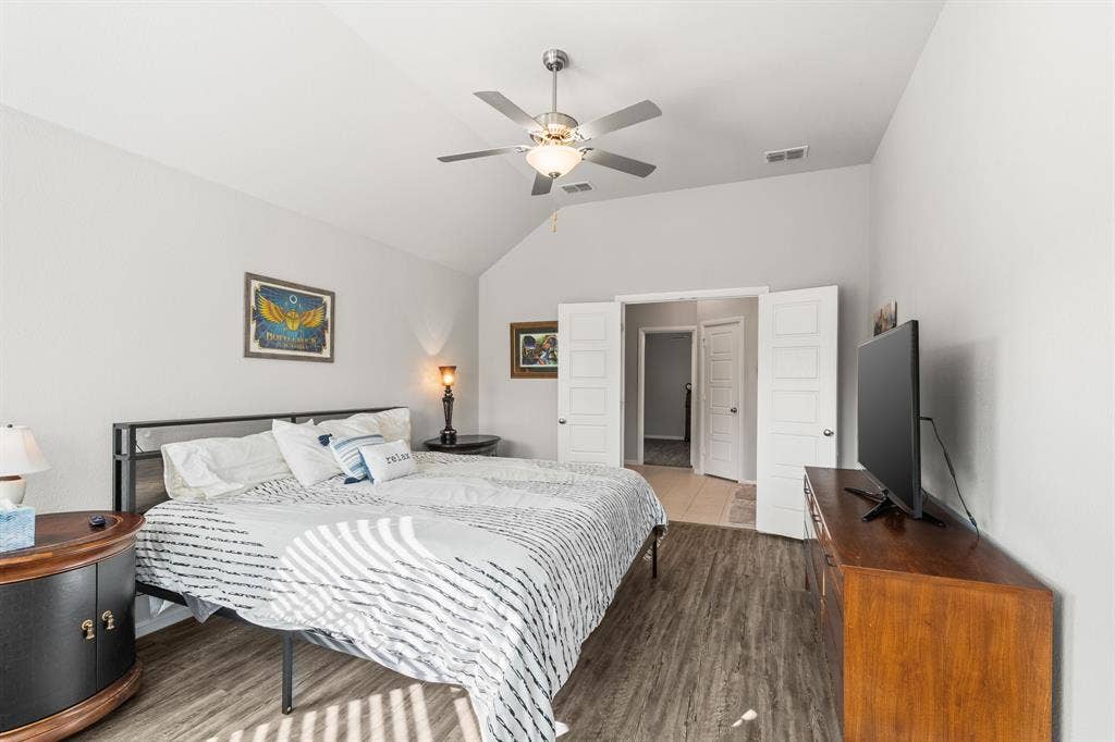 Primary bedroom and looks into primary bath