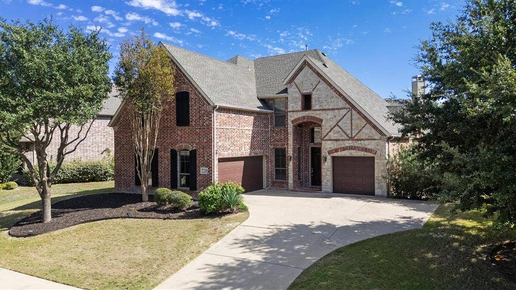 7710 Keith Lane, Sachse, TX 75048 Beautiful 3 car garage, brick and stone exterior built by Shaddock Homes.