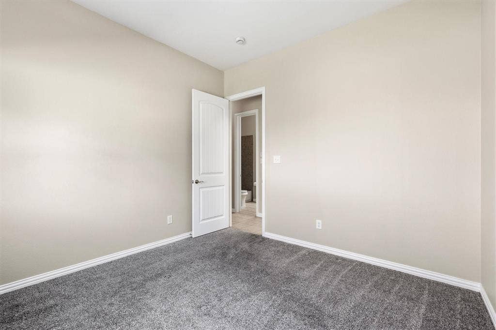 7710 Keith Lane, Sachse, TX 75048 Secondary bedroom downstairs. Perfect for guests or multigenerational living