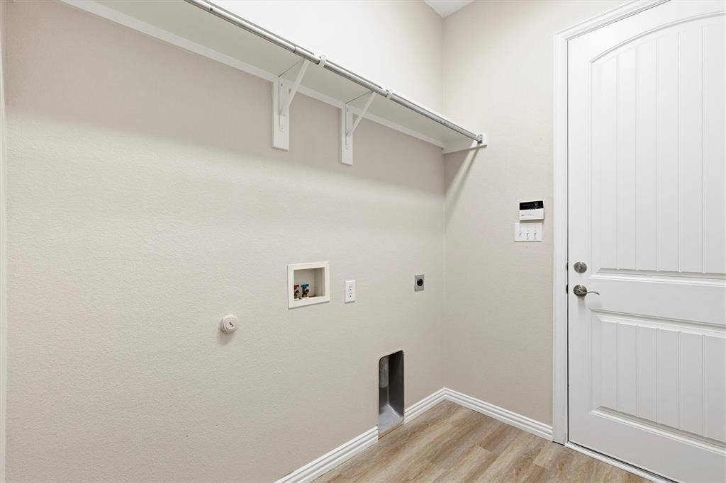 7710 Keith Lane, Sachse, TX 75048 Convenient downstairs laundry room