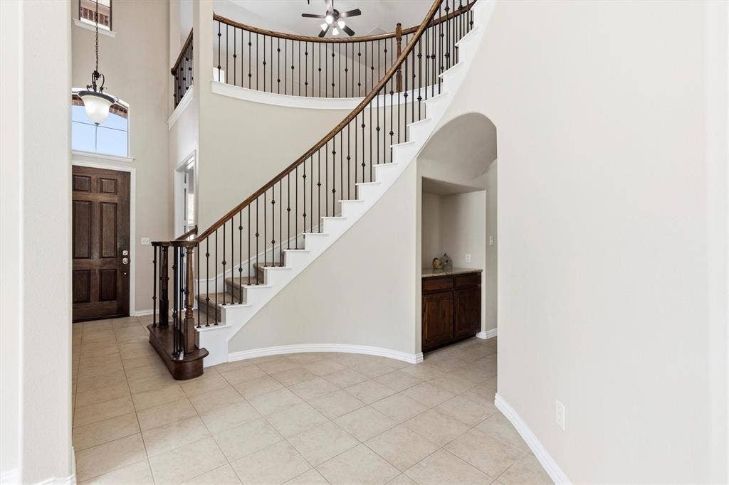 7710 Keith Lane, Sachse, TX 75048 View of grand staircase and planning nook off the kitchen